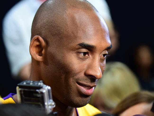 TO GO WITH AFP STORY by Rob WOOLLARD, Basket-NBA-Lakers-Bryant (FILES) Kobe Bryant of the Los Angeles Lakers meets the press during interviews at the Los Angeles Lakers media day in this September 28, 2015, file photo in El Segundo, California. After a glittering career spanning three decades, the final curtain is slowly coming down on Kobe Bryant -- but few are expecting a Hollywood ending for the Los Angeles Lakers superstar. AFP PHOTO / FREDERIC J. BROWN/FILES