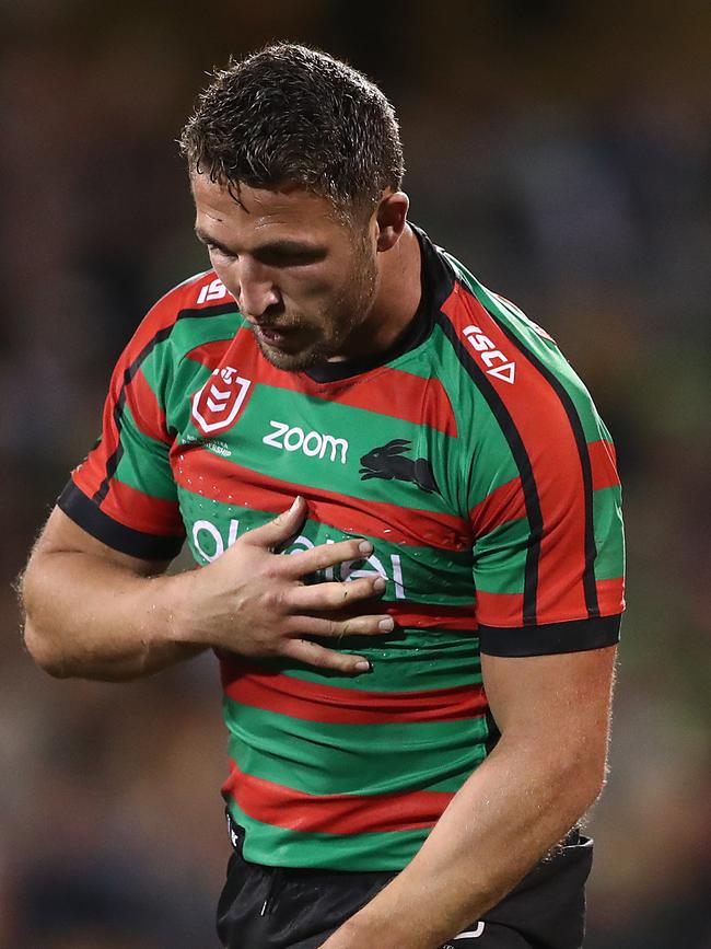 Sam Burgess clutches his problematic shoulder.