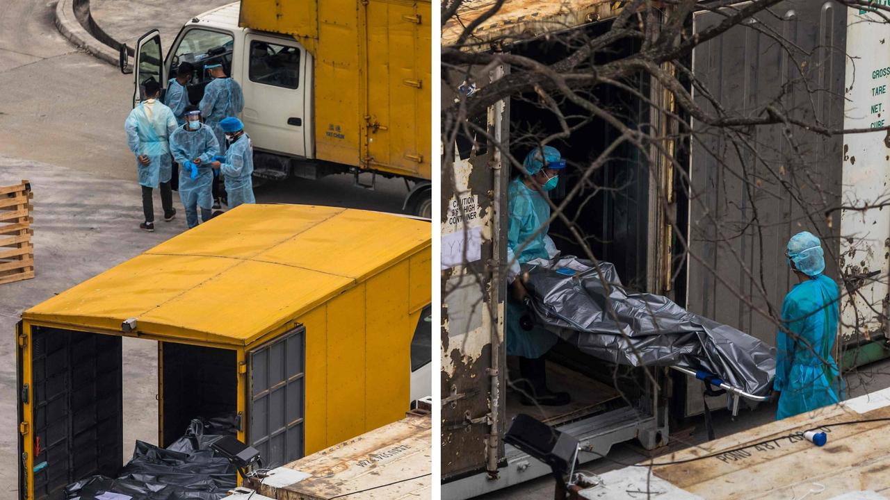 Bodies are being stored in shipping containers as Hong Kong's morgues are overwhelmed during a deadly Omicron surge. Pictures: AFP