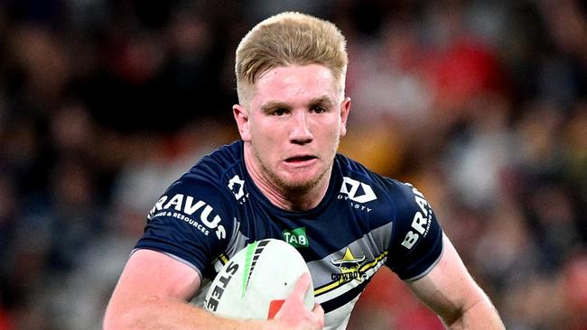 BRISBANE, AUSTRALIA - AUGUST 25: Tom Dearden of the Cowboys breaks away from the defence during the round 26 NRL match between Dolphins and North Queensland Cowboys at Suncorp Stadium on August 25, 2023 in Brisbane, Australia. (Photo by Bradley Kanaris/Getty Images)