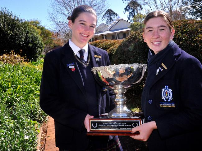 Fairholme College equestrian team captains Torra MacDonald and Simone Sorrenson celebrate the school winning a third straight Lorette Wigan Cup.