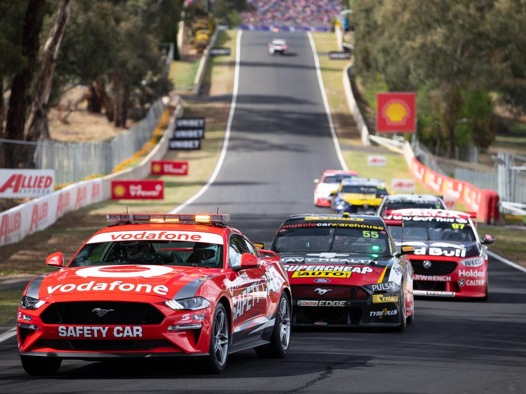 The field follows the safety car. (Photo by Daniel Kalisz/Getty Images)