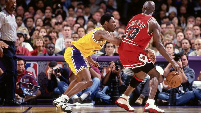 Kobe Bryant defends against Michael Jordan. (Photo by Andrew D. Bernstein/NBAE via Getty Images)