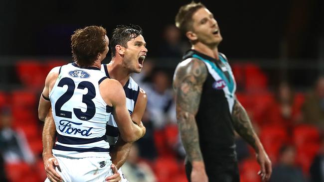 Star Geelong forward Tom Hawkins celebrates after kicking one of his six goals in the Cats’ 60-point win over Port Adelaide at Metricon Stadium. Picture: Getty Images