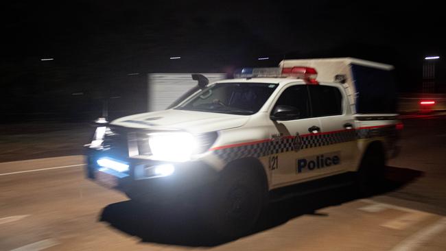 Emergency service vehicles arrive at the Darwin Correctional Facility after prisoners were reported on the roof after a mass breakout. Picture: Che Chorley