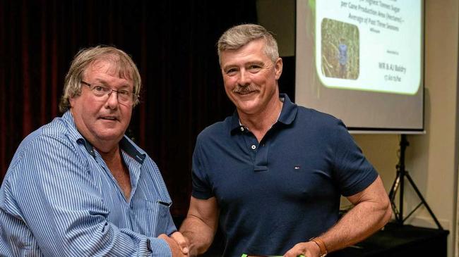 WINNERS: Bundaberg Canegrowers chairman Allan Dingle and District Champion Wayne Baldry. Picture: PAUL BEUTEL