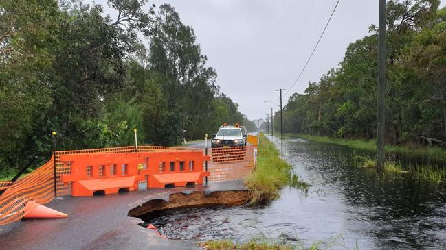 The piece of the Wooli Road that has collapsed due to the large amount of water flowing from recent torrential rain. Photo: Nikki Voss Media.