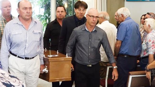 Family members and friends carry Jeff Snelling on his final journey after the funeral to remember the hero who died after saving his sons at Lake Tinaroo on February 12, 2023. Picture: Alison Paterson