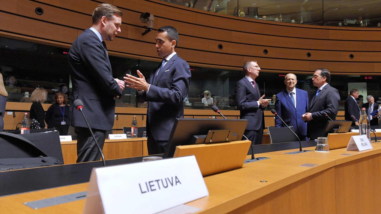 Foreign Affairs Ministers of Lithuania Gabrielius Lansbergis (L), Italy Luigi Di Maio (2nd L), Latvia Edgars Rinkevics (C), Cyprus Nikos Christodoulides (2nd R) and Spain Jose Manuel Albares Bueno (R) talk before a Foreign Affairs Council meeting at the EU Council (Photo by JOHN THYS / AFP)