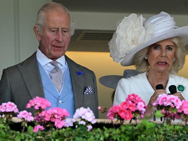 Britain's King Charles III (L) and Britain's Queen Camilla react as their horse Gilded Water loses The King George V Stakes on the third day of the Royal Ascot horse racing meeting, in Ascot, west of London, on June 20, 2024. (Photo by JUSTIN TALLIS / AFP)