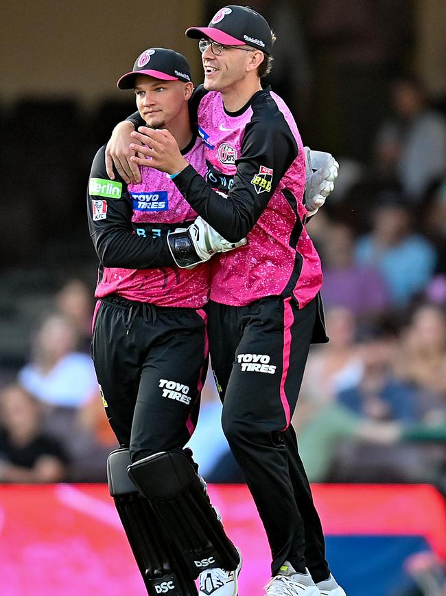 The Sixers celebrate grabbing the wicket of Glenn Maxwell during the power surge.