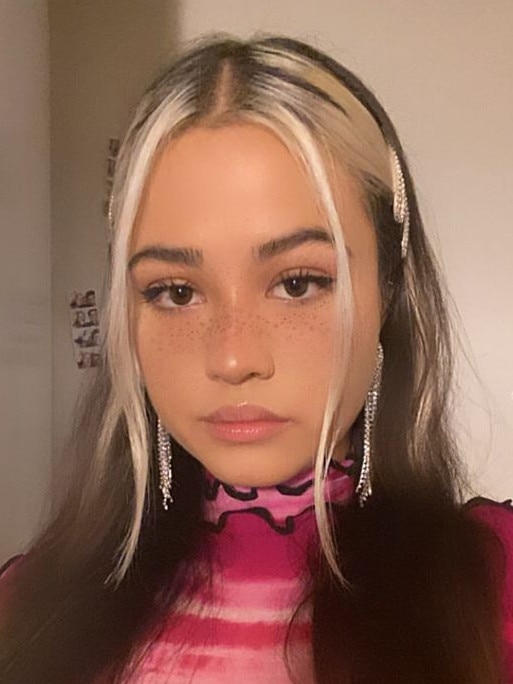 The 23-year-old in the hot pink top that her mother Pat Hoffie said had alerted the second train driver that she was injured on the subway tracks. Picture: Facebook