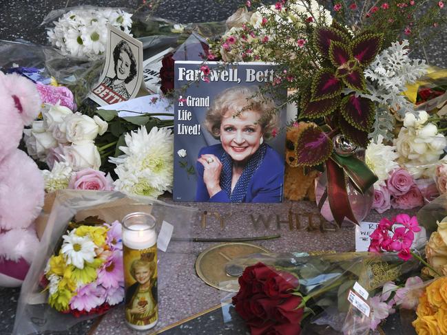 Flowers and mementos are placed on the Hollywood Walk of Fame star of late actress Betty White, who resided in Hollywood. But reports say she wasn’t happy in her L.A. home. Picture: AFP