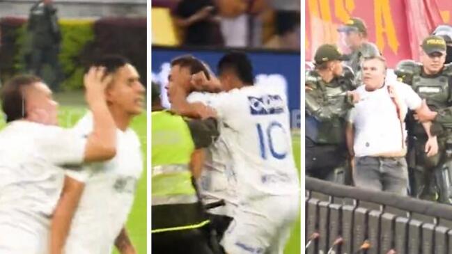 Fan attacks player! Player gets red carded for fighting back!