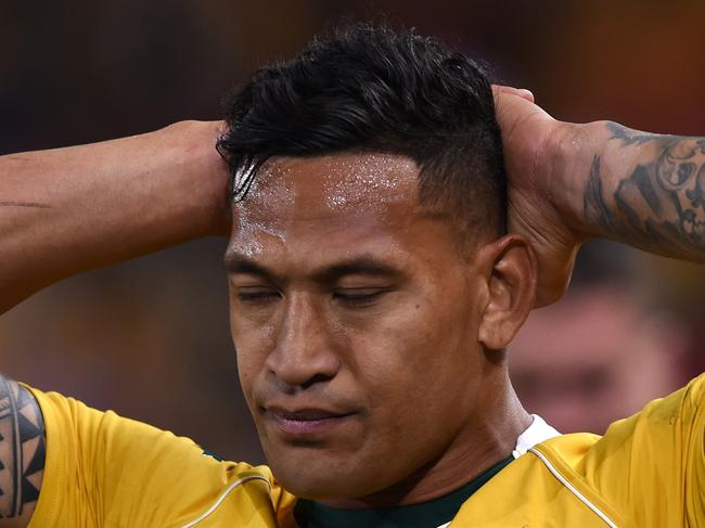 Wallabies player Israel Folau reacts following the First Test between the Australia Wallabies and the England Roses at Suncorp Stadium in Brisbane, Saturday, June 11, 2016. (AAP Image/Dave Hunt) NO ARCHIVING, EDITORIAL USE ONLY