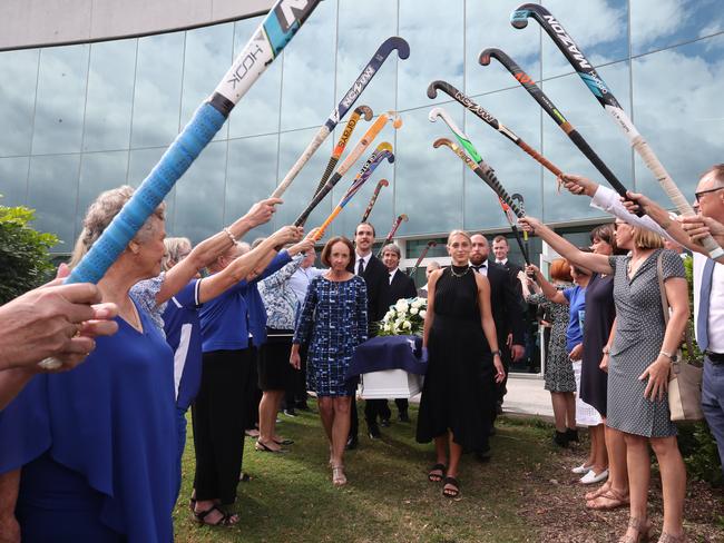 Daphne Pirie funeral at RACV Royal Pines resort. Hockey players form a Guard of Honour as pallbearers Jodie Holmes and Bonnie-Ray Pirie help carry the coffin to the waiting hearse. Picture Glenn Hampson