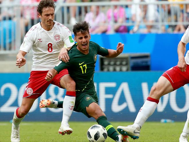 SUNDAY TELEGRAPH SPECIAL. PLEASE TALK WITH JEFF DARMANIN ST PIC ED BEFORE PUBLISHING.  SoccerooÕs Daniel Arzani is tackled by DenmarkÕs Thomas Delaney and DenmarkÕs Henrik Dalsgaard during the World Cup match between Australia and Denmark at Samara Arena, Russia. Picture: Toby Zerna