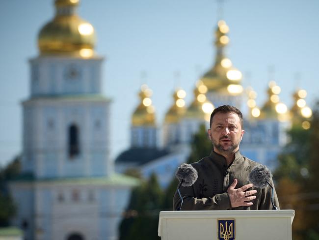 This handout photograph taken and released by Ukrainian Pesidential press service on August 24, 2024, shows Ukraine's President Volodymyr Zelensky speaking during the 33rd Independence Day ceremony at Saint Sophia Square, in Kyiv on August 24, 2024, amid the Russian invasion of Ukraine. (Photo by SERGEI CHUZAVKOV / UKRAINIAN PRESIDENTIAL PRESS SERVICE / AFP) / RESTRICTED TO EDITORIAL USE - MANDATORY CREDIT 
