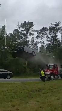 Car Goes Airborne After Hitting Tow Truck Ramp 