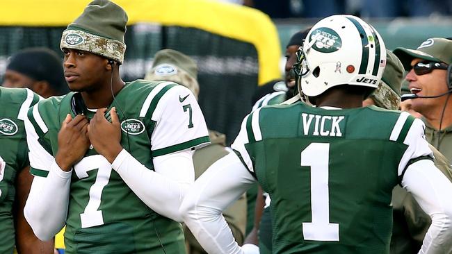 Backup Geno Smith #7 and starting quarterback Michael Vick #1 of the New York Jets.