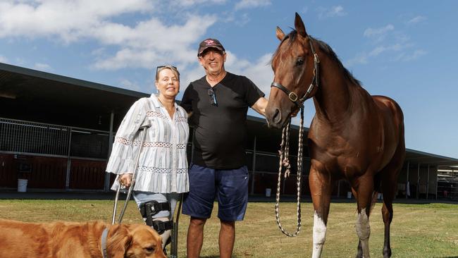 Trainer Rob Heathcote with wife Vicky and sprinter Pretty Dubious at their Eagle Farm stables. Picture Lachie Millard