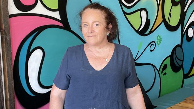 Double Shot Coffee Co. business owner, Susan Hunter, pictured in front of her cafe's street art feature wall. Picture: Gemma Ferguson