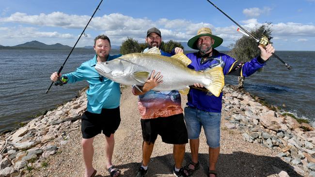 Townsville Barramundi Restocking Group President Rhyce Bullimore flanked by Townsville City councillors Brady Ellis and Kristian Price at Ross River Dam. Picture: Evan Morgan