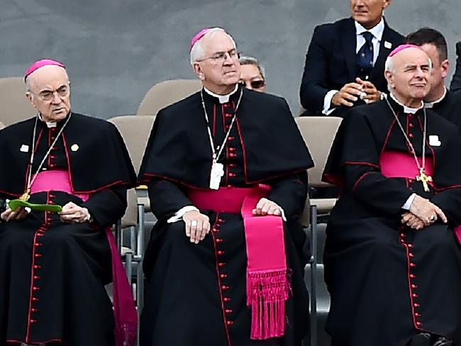 Archbishop Carlo Maria Vigano (L) accused senior Vatican officials of knowing as early as 2000 that Theodore McCarrick regularly invited seminarians into his bed. Picture: AFP