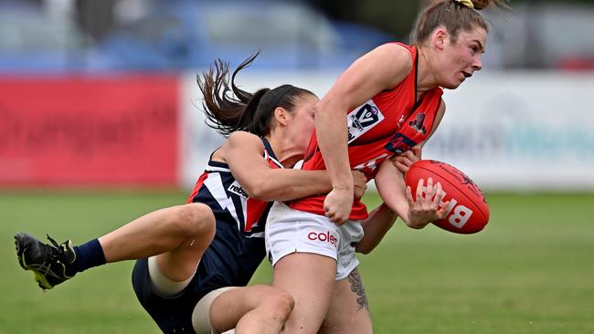 VFLW: Darebin’s Nicole Callinan tries to bring down Essendon’s Grace Dicker. Picture: Andy Brownbill