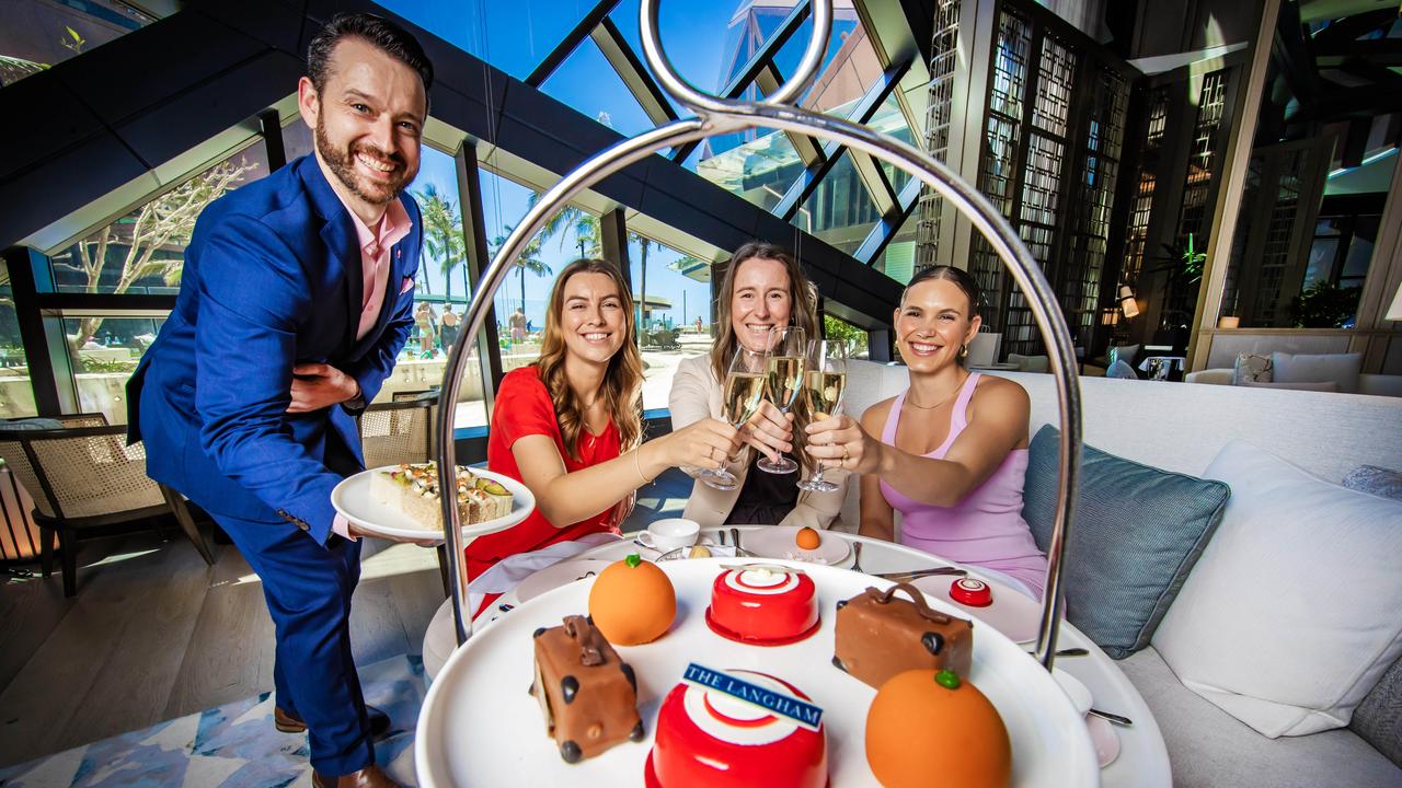 The Langham hotel’s Greg Rutherford with Alice Hanot, Emma Hale and Jess Sims enjoying a Paddington-themed high tea. Picture: Nigel Hallett