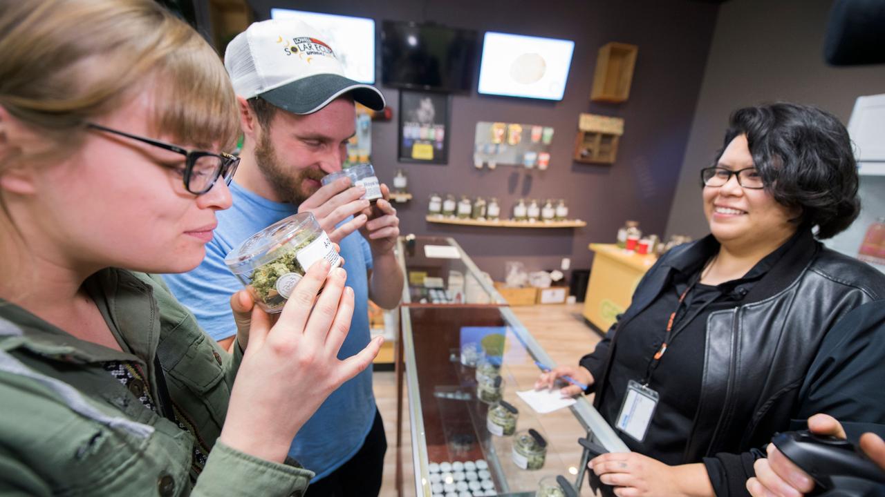 Customers at a cannabis dispensary on the first day of legal recreational marijuana sales in California in 2018. Picture: AFP PHOTO / Robyn Beck