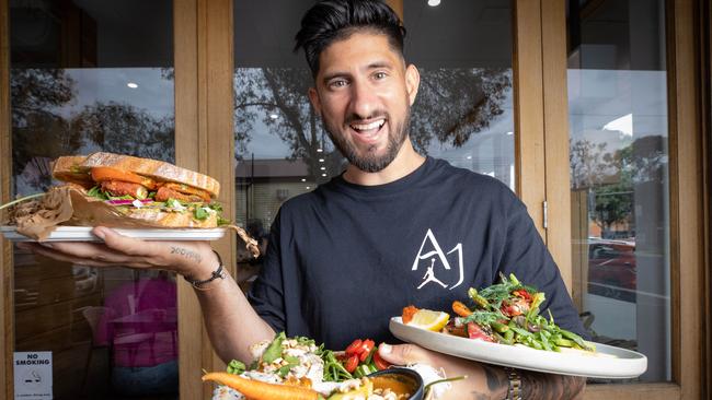 Eat Sacred’s Dean Fourtzis with some of his healthy sandwiches and health bowls. Picture: Jason Edwards.