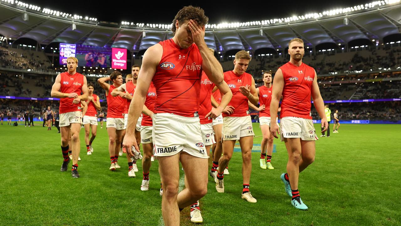 Andrew McGrath of the Bombers walks from the field. Picture: Paul Kane/Getty Images