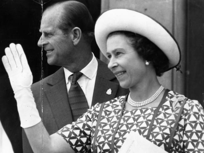 The Queen waves and smiles as she leaves church service at St. Peter’s Cathedral.