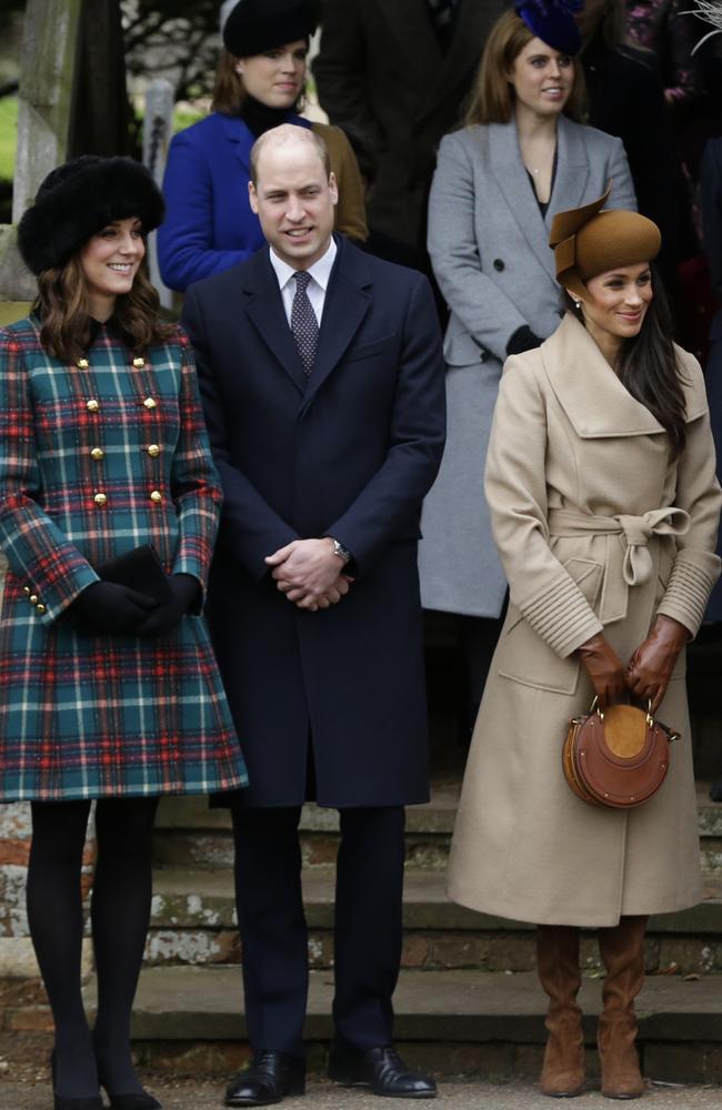 Britain's Kate, Duchess of Cambridge, left, with Prince William and Meghan Markle the fiancee of Prince Harry, right, wait for the Queen to leave by car following the traditional Christmas Day church service. Picture: AP