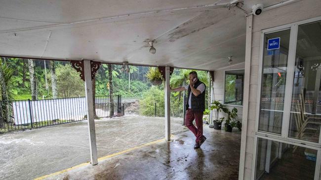 Mark Andrew from Curtis Falls Cafe which was inundated with water at Tamborine Mountain. Picture: Nigel Hallett