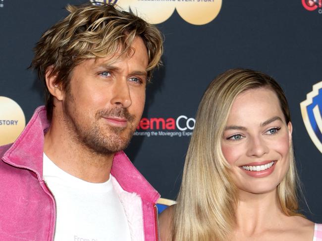 LAS VEGAS, NEVADA - APRIL 25:  Ryan Gosling (L) and Margot Robbie pose for photos as they promote the upcoming film 