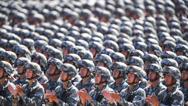 Chinese soldiers applauding during a military parade at the Zhurihe training base in China's northern Inner Mongolia region. Picture: AFP