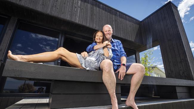 Pete Stavroff with partner Rachael in their home at Orient Dr, Sunrise Beach — a Frank Macchia architect designed house inspired by Japanese architecture and techniques. Photo: Lachie Millard.