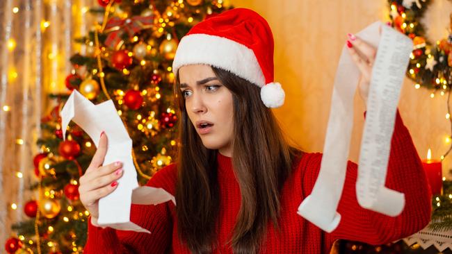 Christmas preparations, concept of much expenses on Christmas presents and decorations; spending surprise shock generic