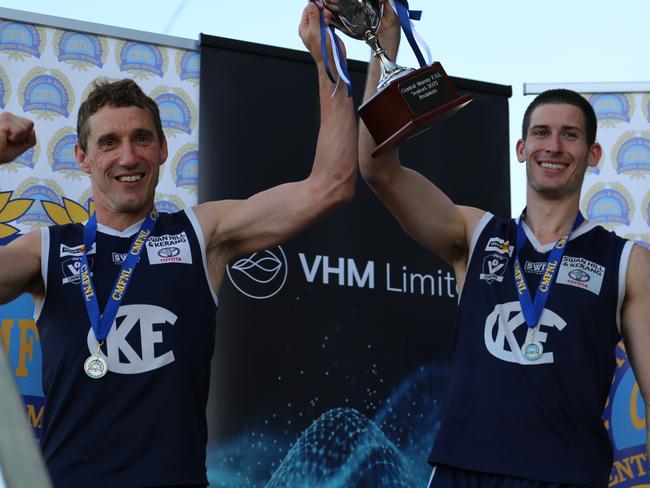 Kerang coach Troy Coates, left, and captain Josh Nitschke lift the Central Murray premiership cup.  Picture: Tracy Roberts