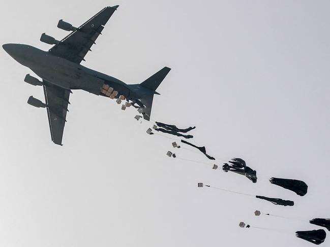 A United Arab Emirates Air Force C-17 Globemaster III military transport aircraft drops aid packages on the northern Gaza Strip. Picture: AFP