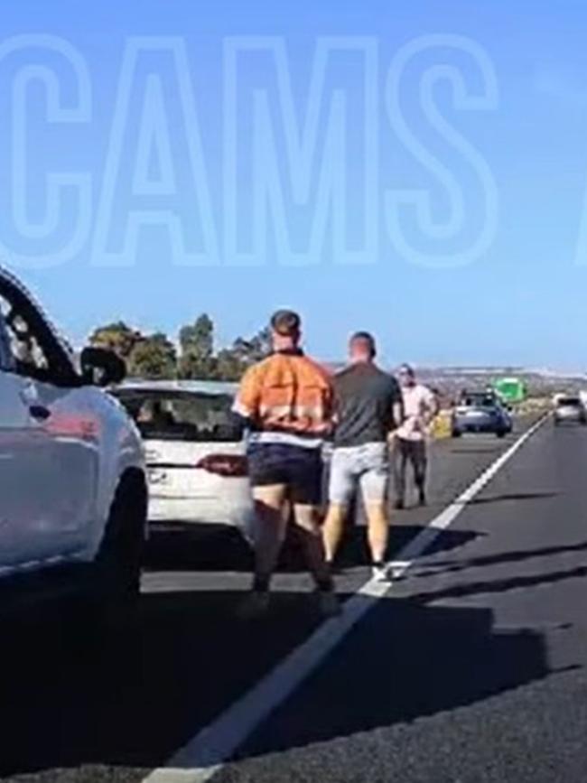 The incident spilt onto the 110kn/h road, forcing cars to swerve to avoid the men. Picture: DashCamsAdelaide,