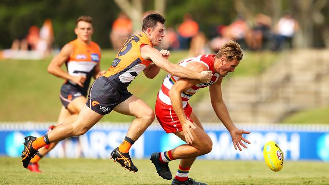 Swans rookie Will Gould chases the footy.