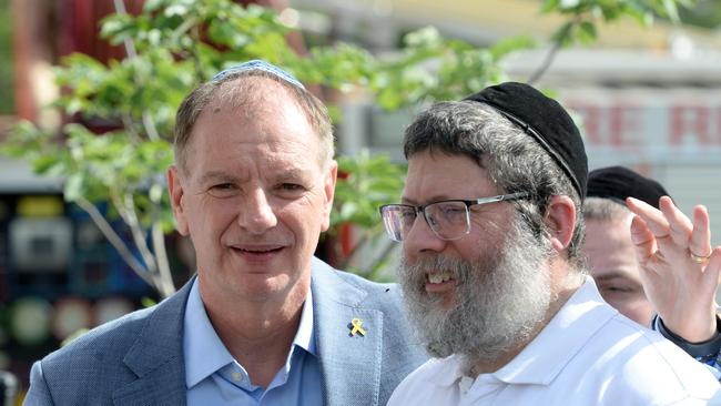 Yumi Friedman, right, who was inside the Addass Israel synagogue at East St Kilda at the time of the fire, speaks with David Southwick MP. Picture: Andrew Henshaw