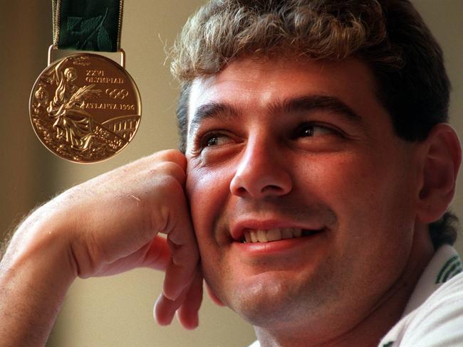 Michael Diamond with his gold medal from the Atlanta Olympics in 1996.