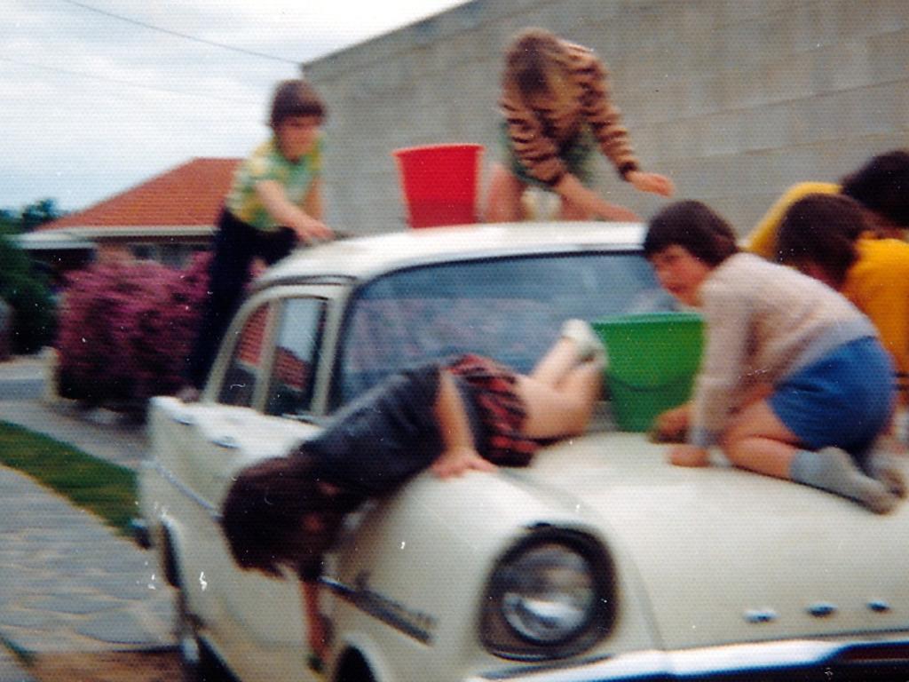 Fun times. Some of my siblings washing a family member’s Holden in 1974. Picture supplied by Bronwyn Michelle, Salisbury East.