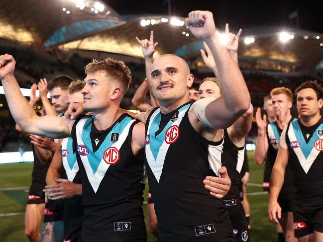 Powell-Pepper celebrates with teammates after the Power beat the Cats to qualify for their second-consecutive preliminary final appearance. Picture: Getty