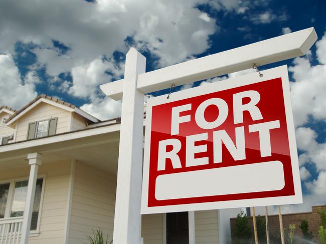 Left Facing Red For Rent Real Estate Sign in Front of Beautiful House.