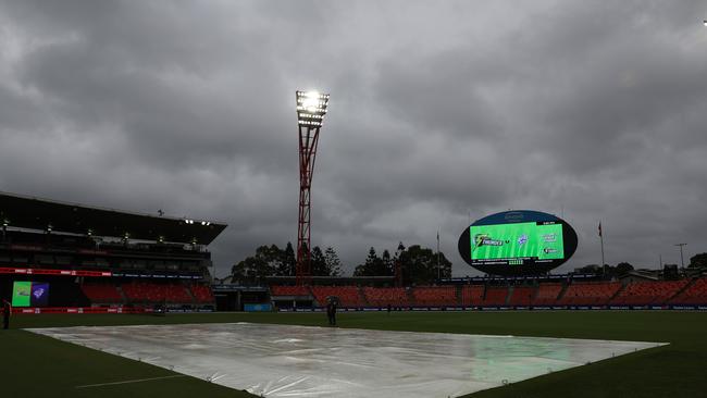 The covers are seen on the pitch as rain delays the bat flip during the BBL match between Sydney Thunder and Hobart Hurricanes at ENGIE Stadium, on January 08, 2025, in Sydney, Australia. (Photo by Matt King/Getty Images)